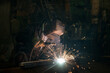 © MIRACLE MOMENTS - Closeup worker in a mask doing the welding in a workshop