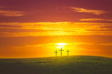 Hill and three cross and birds at sunrise