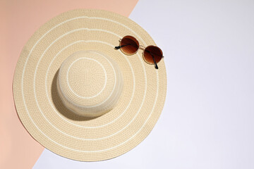 Sticker - Stylish hat and sunglasses on color background, top view. Beach objects