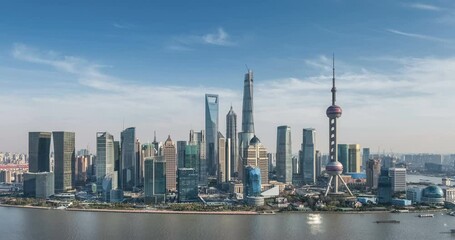 Fototapete - time lapse of shanghai skyline, aerial view of pudong financial center and huangpu river against a blue sky, China.