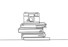 Single Continuous Line Drawing Of Vintage Classic Analog Pocket Camera Above Stack Of Books On Desk. Old Retro Photography Equipment Concept. One Line Draw Design Graphic Vector Illustration
