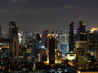 Bangkok cityscape night view in the business district, skyscraper modern building, hotel and resident area with night light in capital city