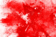 © kitsana - Freeze motion of red powder exploding, isolated on white background. Abstract design of red dust cloud. Particles explosion screen saver, wallpaper