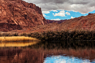  River Colorado acting like a mirror to the surrounding scenery, Lees Ferry landing, Page, AZ, USA