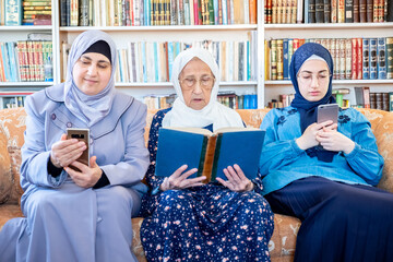 Wall Mural - Happy arabic muslim grandmother and grand daughter and mother si