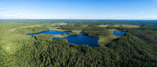 Aerial Drone View Of Blue Lakes And Green Forest. Blue Sky And Clouds.  Beautiful Summer Landscape In Finland. Seitseminen National Park.