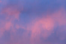 Delicate Feathery Pink Clouds Against A Blue Sky