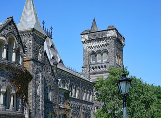 Poster - Detail of old gothic ivy covered stone college building