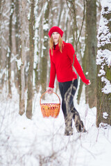 Poster - The beautiful blonde girl in red hat in the forest. Girl in winter. White snow. Little Red Riding Hood. 