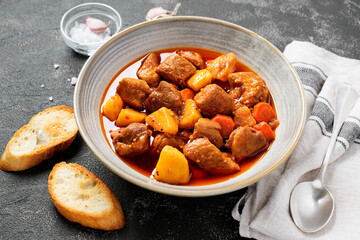 Wall Mural - Pork meat stewed with potatoes, carrots and spices (hungarian goulash).