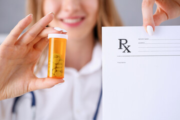 Wall Mural - Female doctor hands hold and give to visitor prescription and jar of pills closeup. Panacea, life save, healthy lifestyle, prescribe treatment, legal drug store, contraception concept