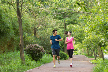 Two friends running on the path