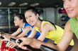 © JodieWang - Group of young people spinning in the gym