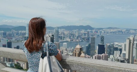 Canvas Print - Tourist woman look at the city in Hong Kong