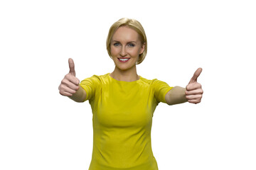 Woman in yellow showing okay with both hands on white background. Smiling lady with outstretched arms.