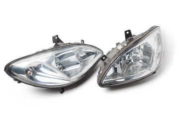 Poster - Pair of halogen headlights for auto optical equipment with corrector and lens inside on white isolated in photo studio. Spare part for the repair of the front body in workshop. Spare parts catalog.