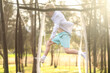 © Caseyjadew - Young caucasion boy jumping on trampoline in golden afternoon light