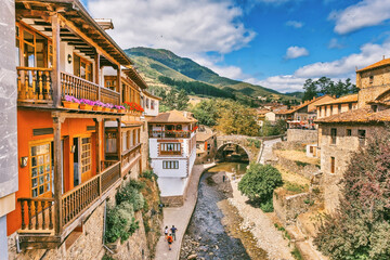 Views of the medieval town of Potes with hanging houses and the Deva river, Cantabria, Spain.