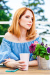 © Andrey_Arkusha - Portrait of a young beautiful woman resting in a summer cafe on the veranda