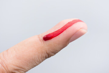 Bleeding blood from the cut finger wound. Injured finger with bleeding open cut wound. Closeup of finger human hand is cut hurt bleeding with bright red blood. 