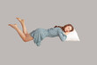 Leinwanddruck Bild - Relaxed girl in vintage ruffle dress levitating in mid-air, sleeping on stomach lying comfortable cozy on pillow, keeping eyes closed, watching peaceful dream. indoor studio shot isolated on gray
