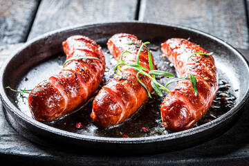 Wall Mural - Closeup of roasted sausage with herbs and pepper