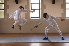 Two Male Fencers Practicing Fencing
