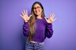 © Krakenimages.com - Young beautiful smart woman wearing glasses over purple isolated background showing and pointing up with fingers number ten while smiling confident and happy.
