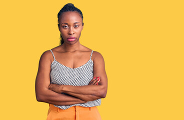 Young african american woman wearing casual clothes skeptic and nervous, disapproving expression on face with crossed arms. negative person.