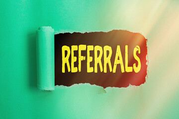 Poster - Word writing text Referrals. Business photo showcasing someone or something to research study or take any further action Rolled ripped torn cardboard placed above a wooden classic table backdrop