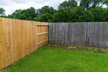 New And Old Privacy Wooden Fences In Back Yard.