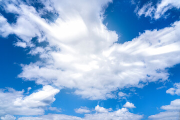 blue bright contrasting cold sky, the sun's rays break through the clouds