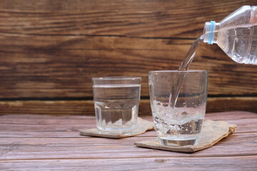 Poster - pouring water into glass