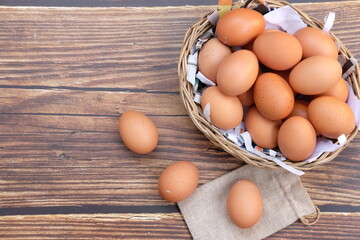 Close up chicken egg on wooden table background and space for text 