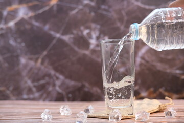 Wall Mural - water pouring into glass