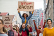 © Rido - Crowd of people march against racism in the street