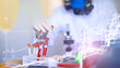 © alexkich - Background researcher in the laboratory is testing drugs for the treatment of viral pneumonia. Coronovirus blood test of infected patients. World pandemic.