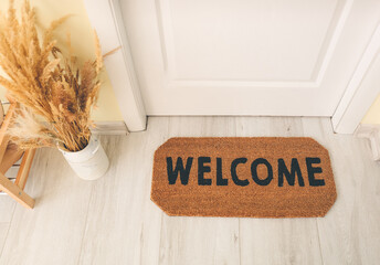 Wall Mural - Door mat on floor in hallway