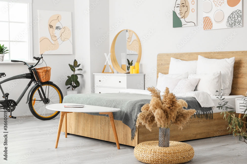 Stylish interior of bedroom with bicycle