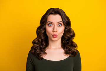 Wall Mural - Close-up portrait of her she nice attractive lovely funny funky winsome glad cheerful cheery wavy-haired girl sending air kiss isolated on bright vivid shine vibrant yellow color background