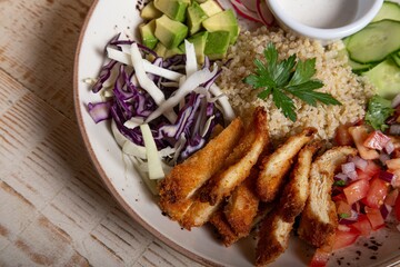 Canvas Print - Plate of vegetable salads and fried meat for lunch