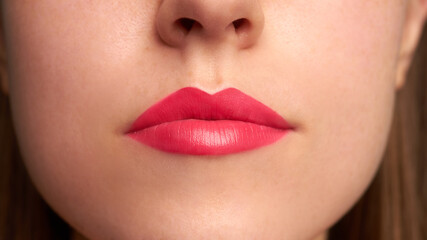 Wall Mural - Close-up shot of woman lips with red lipstick. Beautiful perfect lips. Sexy mouth close up.