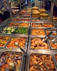 Sticker - Vertical shot of a buffet with Chinese food and dim sum items