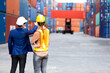 © NVB Stocker - Man manager and woman Supervisor dock cargo checking and control loading Containers box at container yard port of import and export goods. Unity and teamwork concept