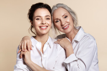 smiling grandmother and daughter