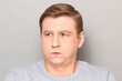 © Andrei Korzhyts - Portrait of disappointed man sighing sadly, looking tired and bored