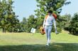 © freebird7977 - Golfer asian man walking in fairway with bag golf at golf  club.  Hobby in holiday and vacation