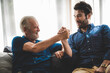 © chokniti - senior father and about son having fun and happy at home, living at home with family