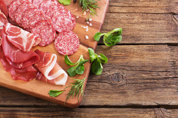 Wall Mural - various types of meat and sausages on  wooden table