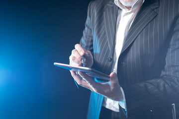 Poster - man with a mobile phone close-up. cell phone in the hands of a businessman. a man in a business suit